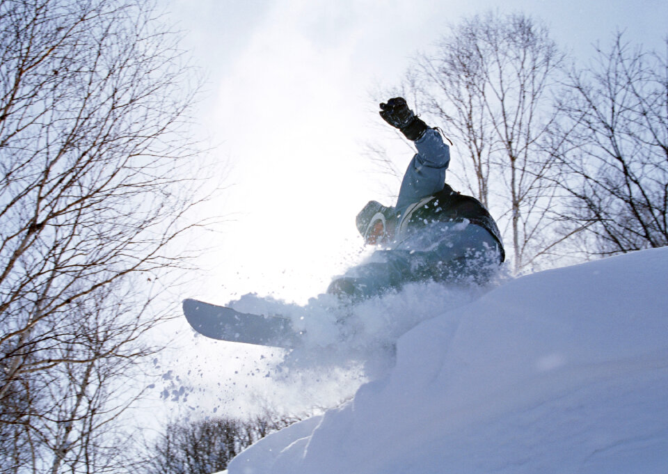 skier in deep powder on a steep slope