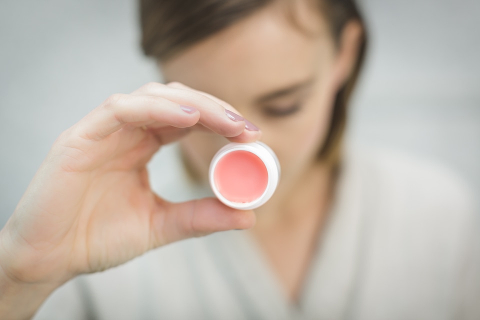 Woman Holding Lipstick