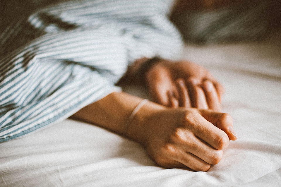 Woman Arms Bed photo