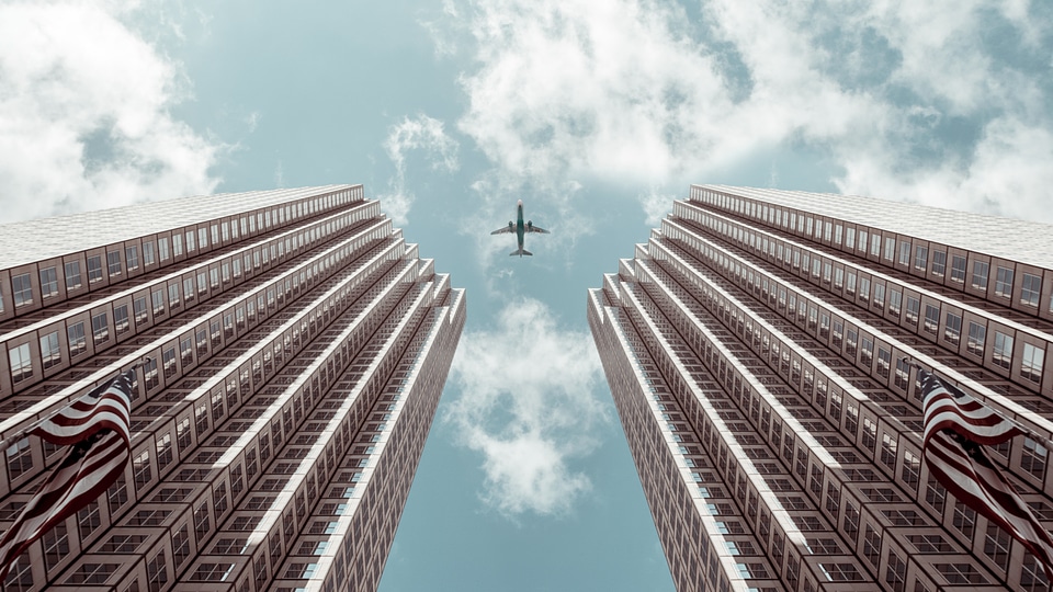 Airplane Between Buildings photo