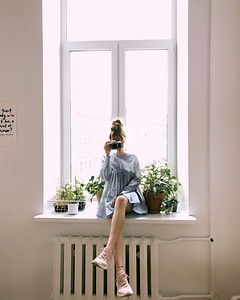 Woman Sitting Window photo