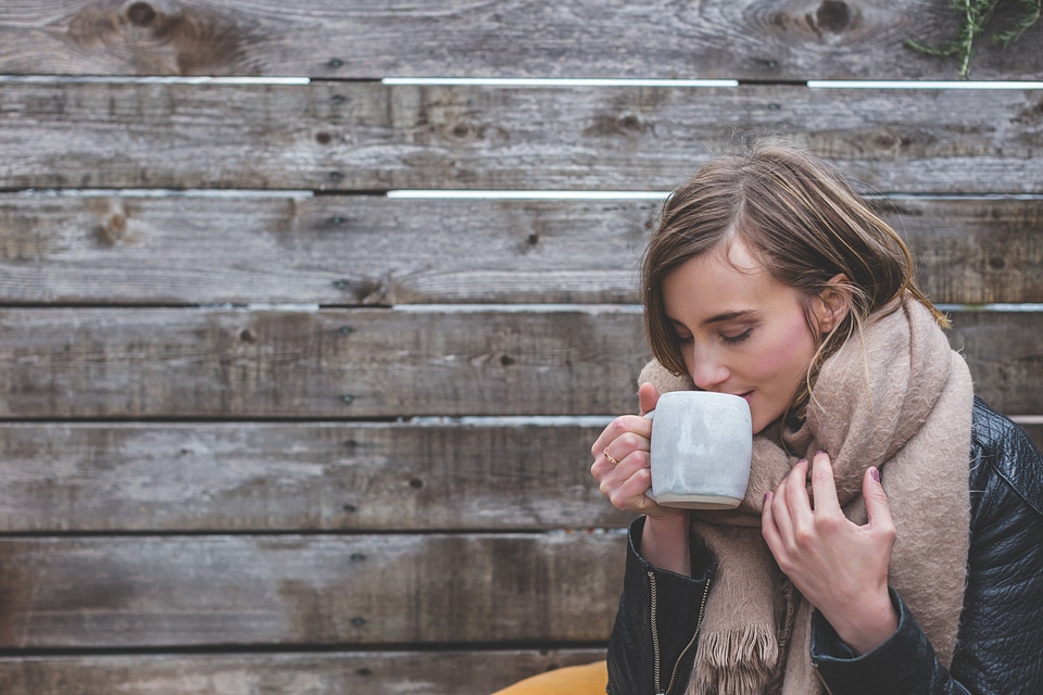 Woman Drinking Hot Coffee photo