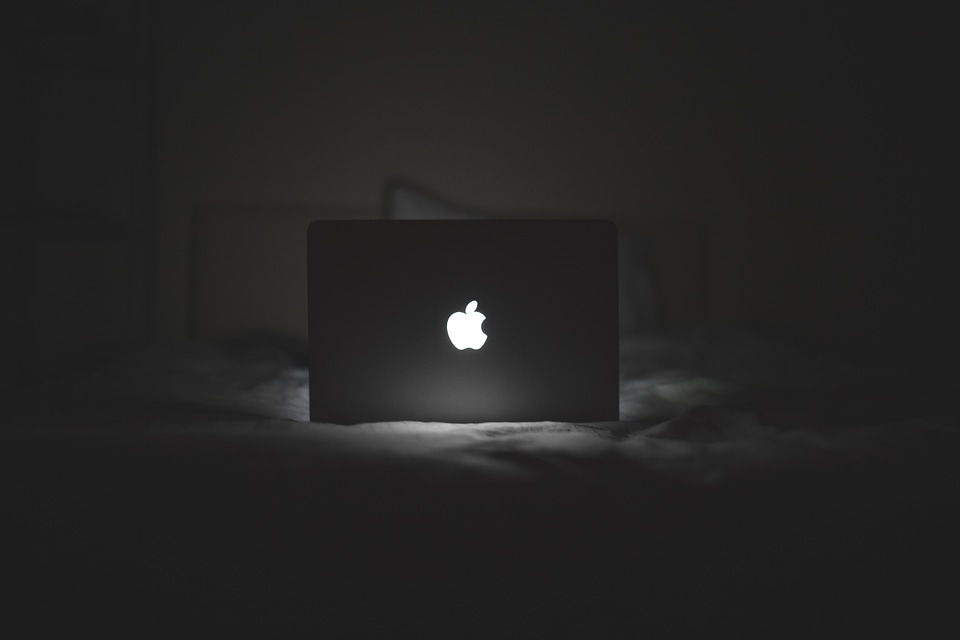 B&W MacBook Glowing Apple Logo photo