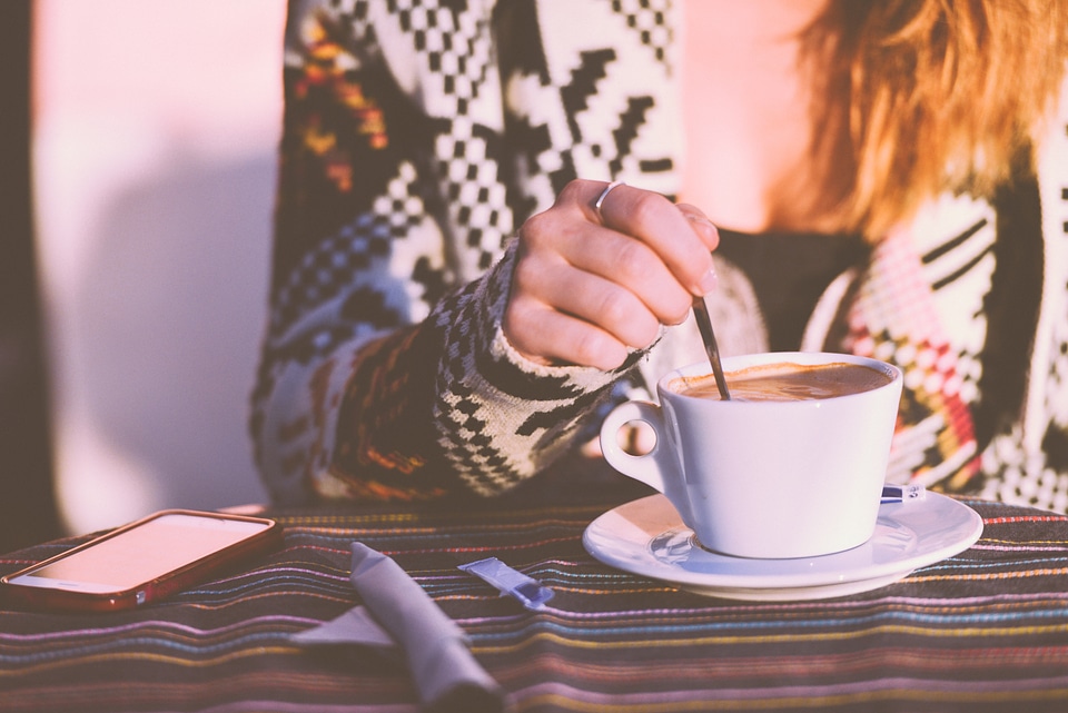 Woman Stirring Coffee photo