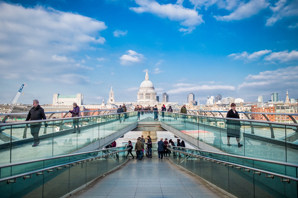 People Crossing Glass Bridge