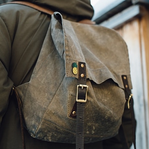 Enamel Pin on Vintage Backpack