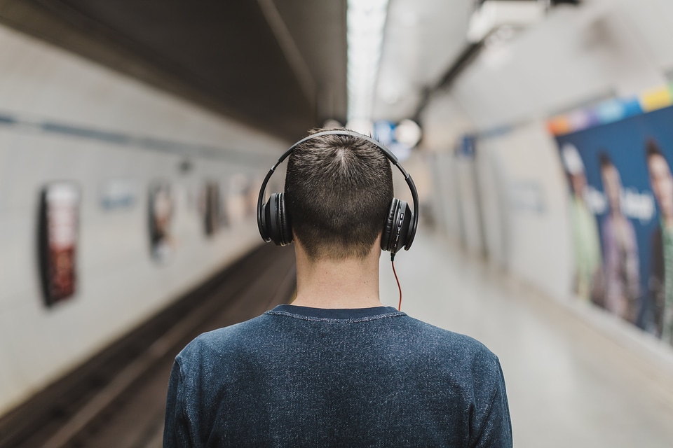 Man Wearing Over Ear Headphones