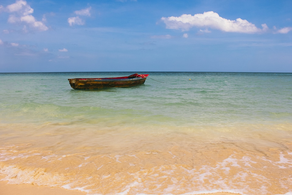 Boat In Clear Blue Ocean