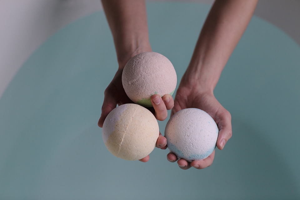 Hands Holding Bath Bombs
