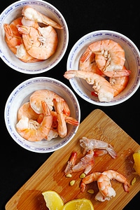 Cooked Shrimp Dressed With Lemon Juice In China Bowls