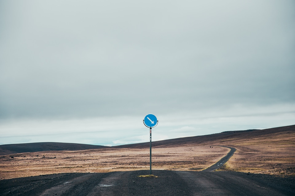 Dark Dirt Road With Sign
