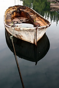 Rusted River Boat On Clear Water photo