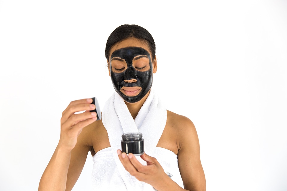 Woman Opening Cosmetic Jar