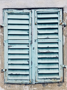 Chipped Blue Paint On Aging Shutters