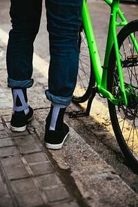 Bike & Feet By Curb photo