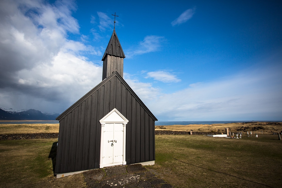 Black Chruch Building Blue Skies