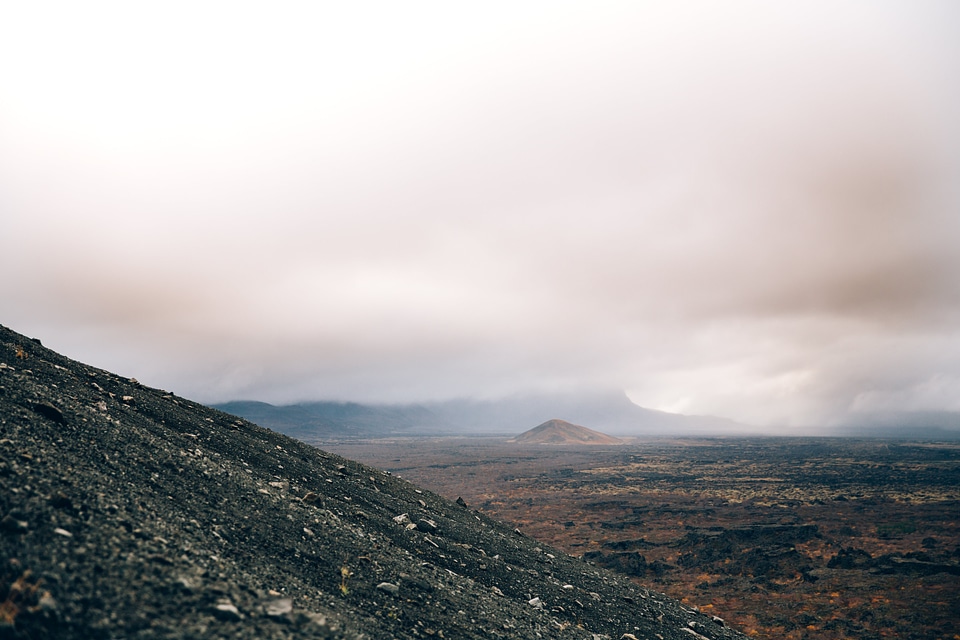 Dry Rocky Landscape With Low Clouds photo