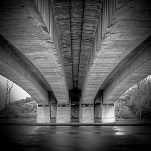 Black And White Under Bridge Over River photo