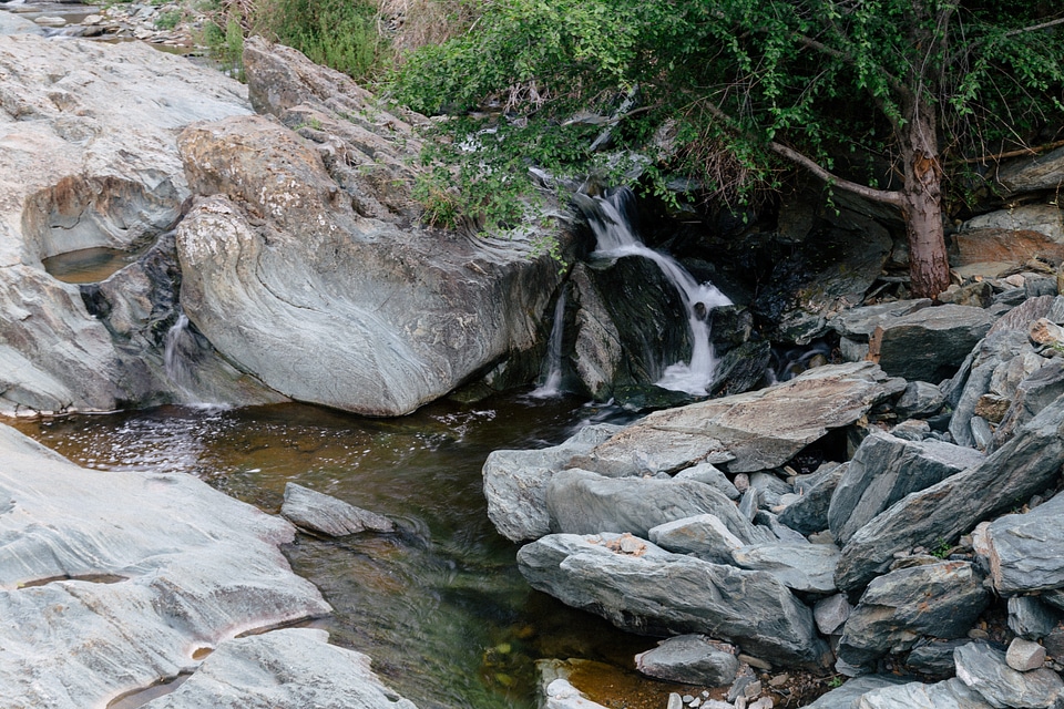 Delicate Waterfall Beside Rocky Stream