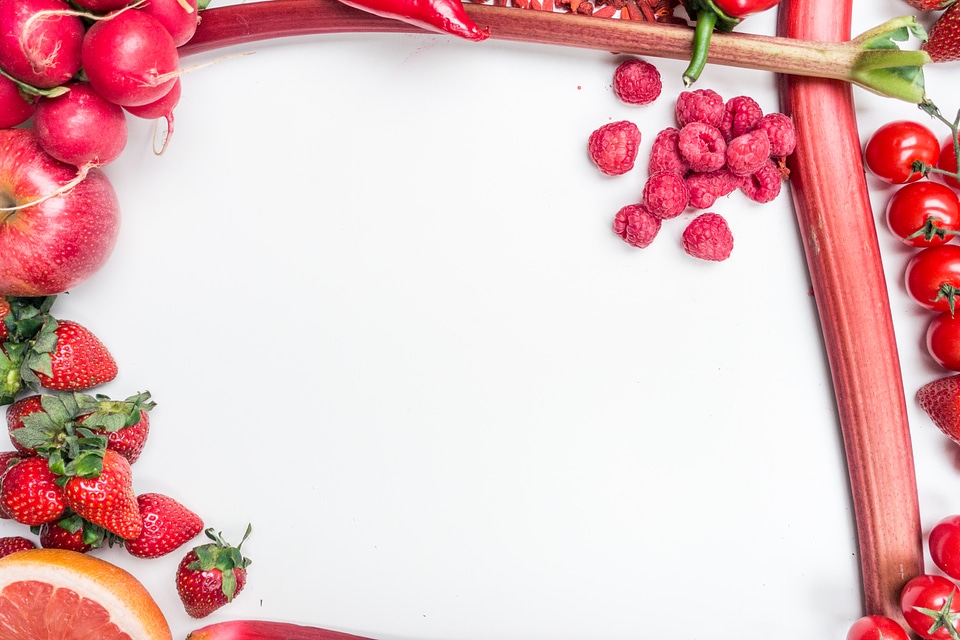 Red fruit and vegetables on a white background