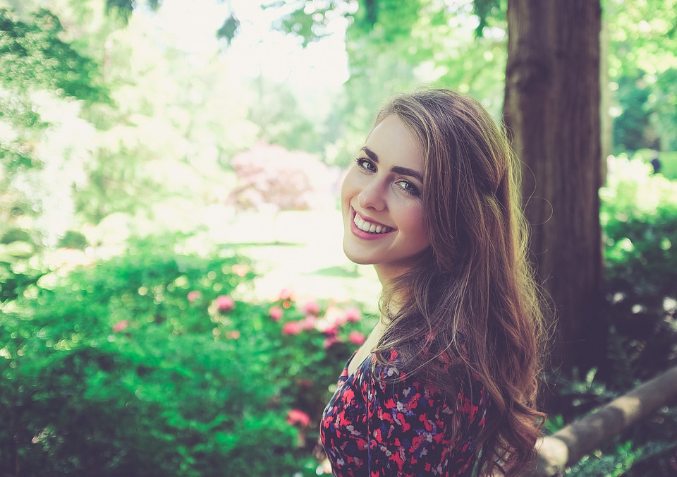 Portrait of Young Smiling Woman in the Garden photo