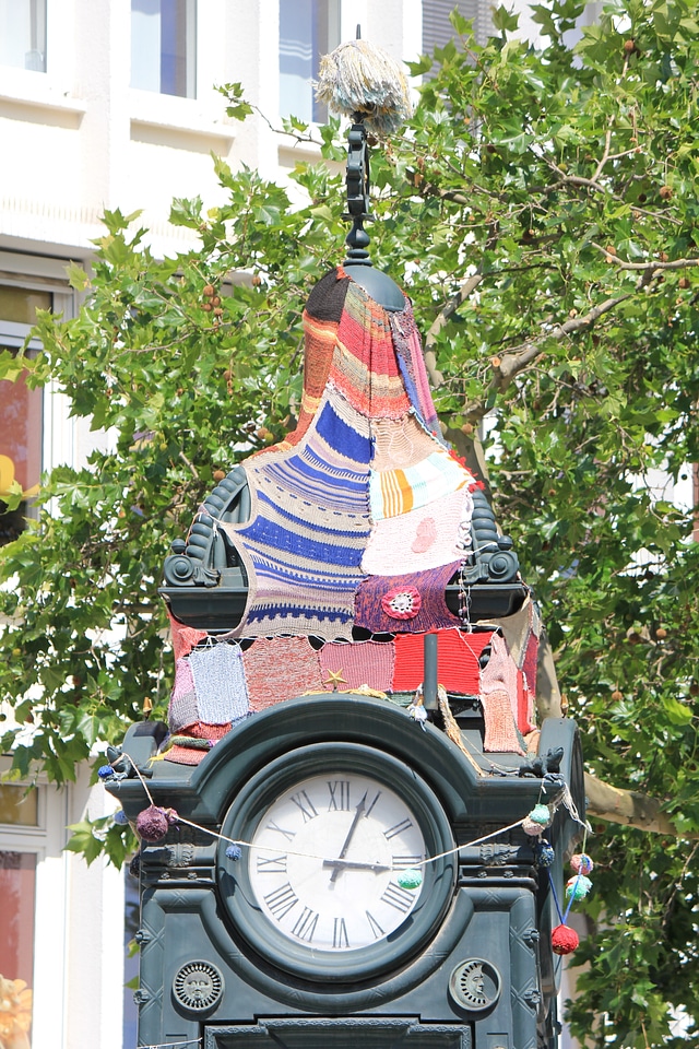 Guerilla knitting on old clock in Hannover