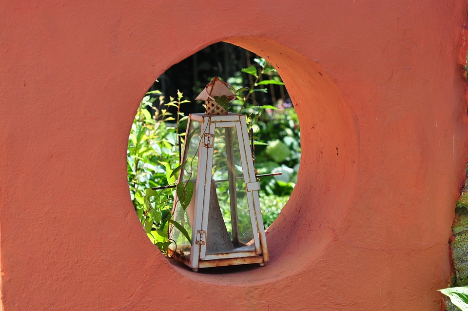 Lantern in wall arch