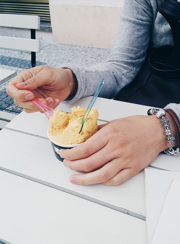 Girl eating ice cream outside