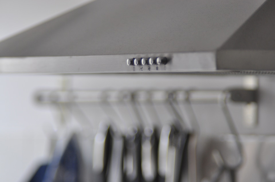 Cooker hood in front of kitchen tools