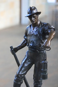Bronze sculpture of a digger photo