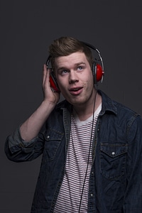 Portrait of Young Man with Red Headphones photo