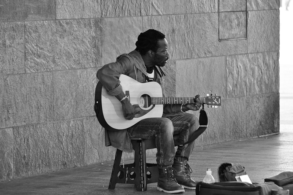 Black guy playing guitar in Cologne