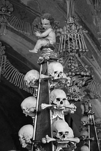 Angel sitting on skulls