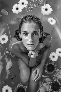 Beautiful Young Woman Having Bath with Flowers photo