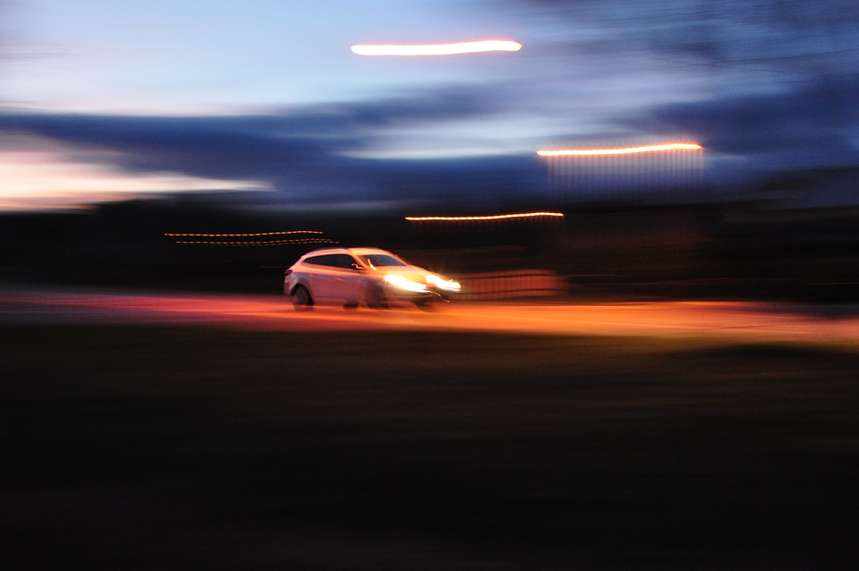 Motion blurred car on road