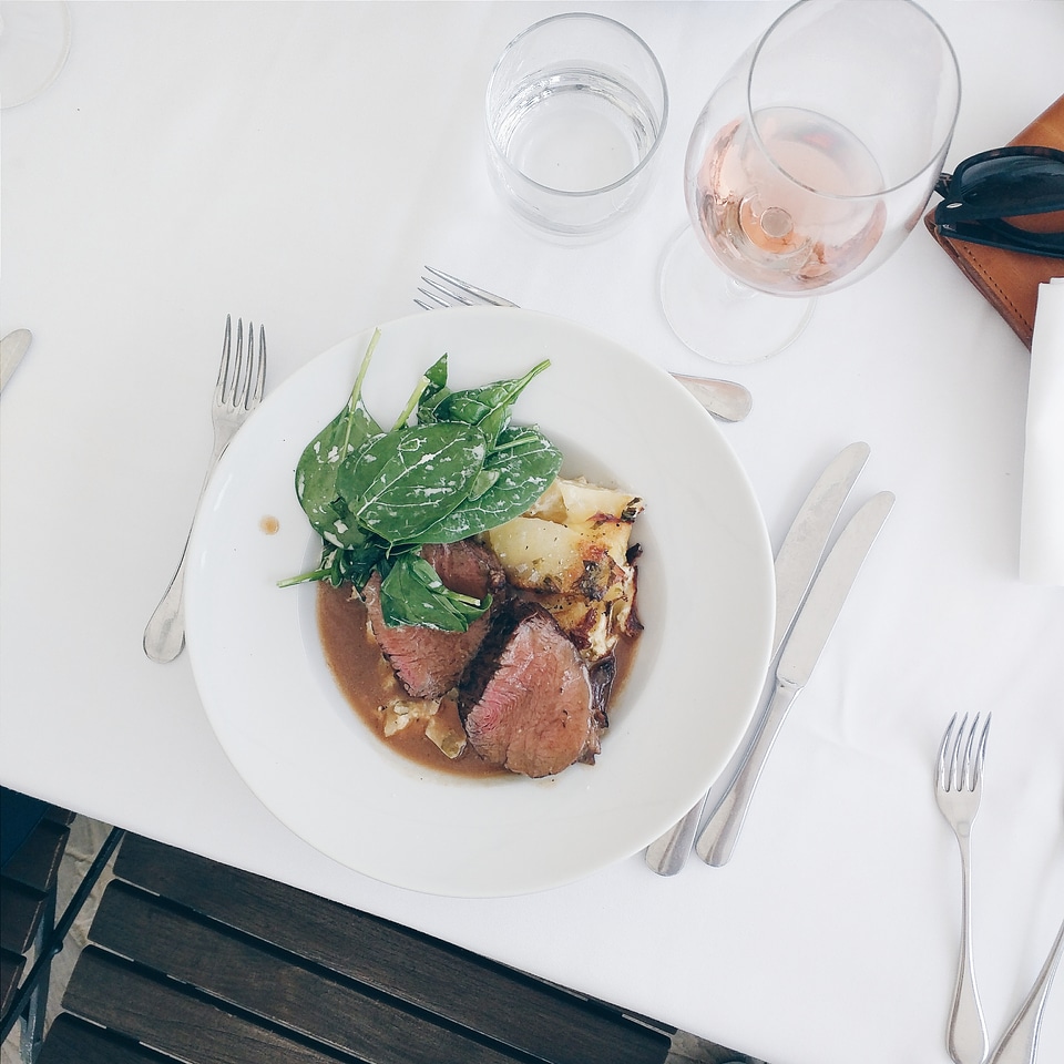 Medium beef steak with spinach and potatoes