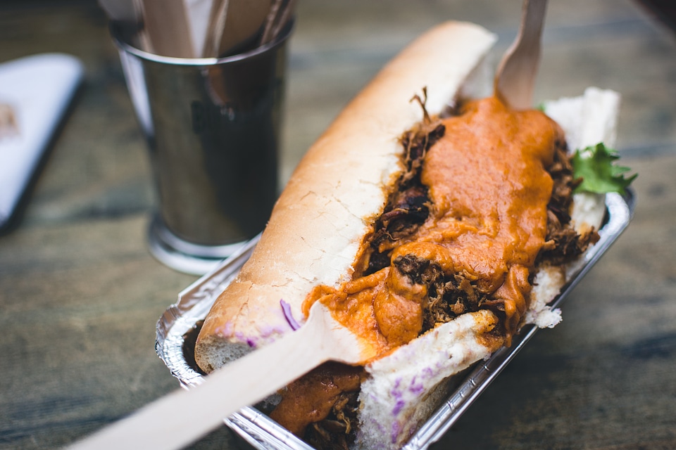 Pulled pork sandwich with cheese sauce