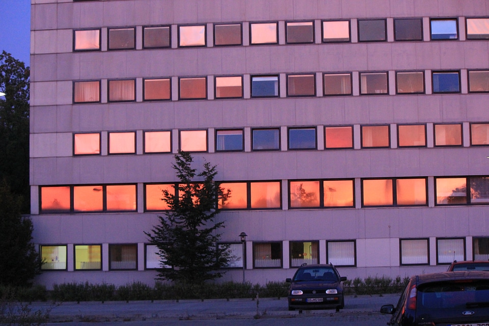 Orange sun reflecting in windows