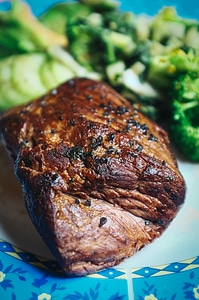 Beef steak with black salt close up photo
