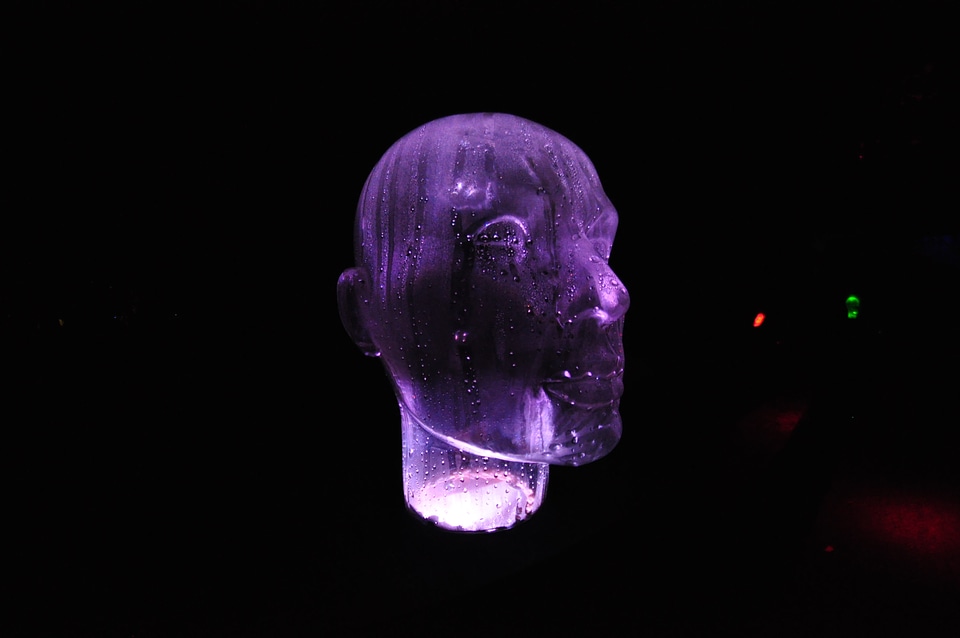 Purple illuminated glass head