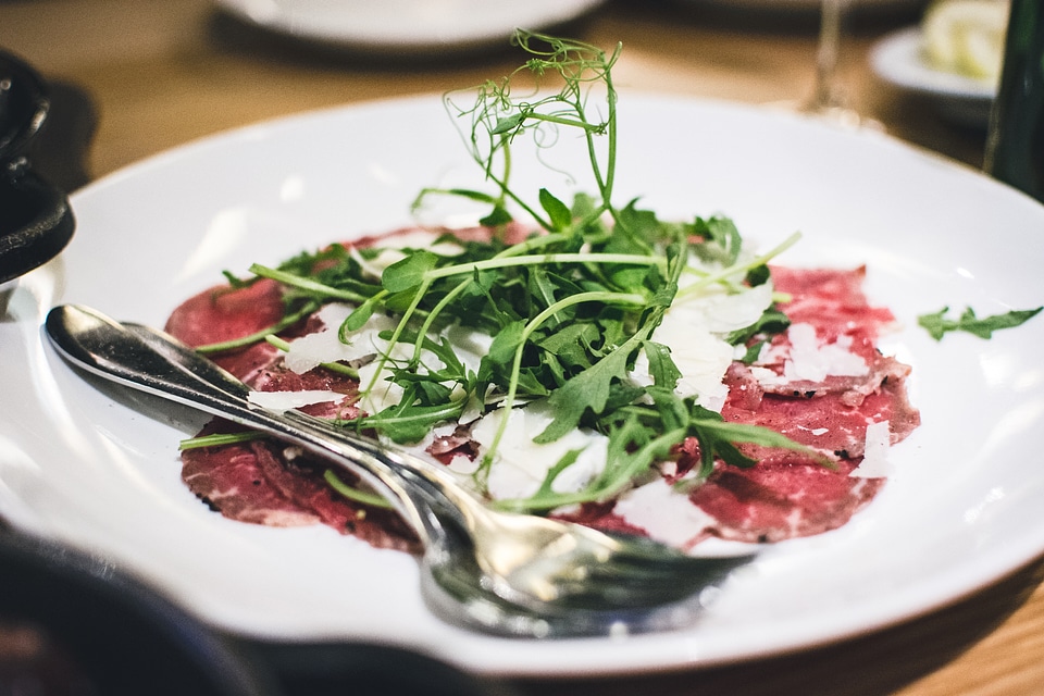Bresaola carpaccio with rocket leaf
