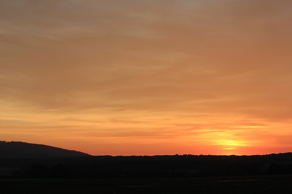 Orange sundown behind Bredelem
