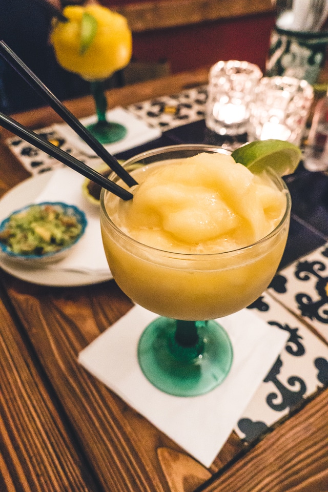 Serving fresh coconut ice cream in young coconut