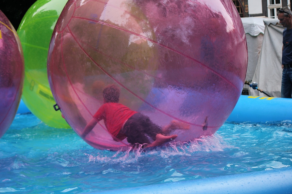 Small boy inside giant beach ball