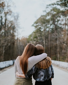 Back View of Two Girls Hugging photo
