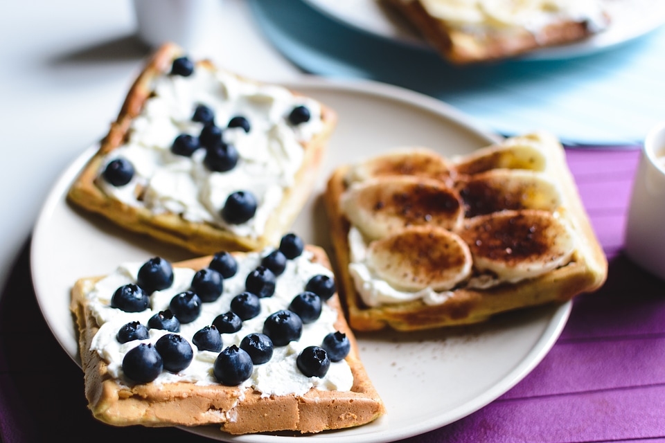 Banana and bluberries waffles with coffee espresso