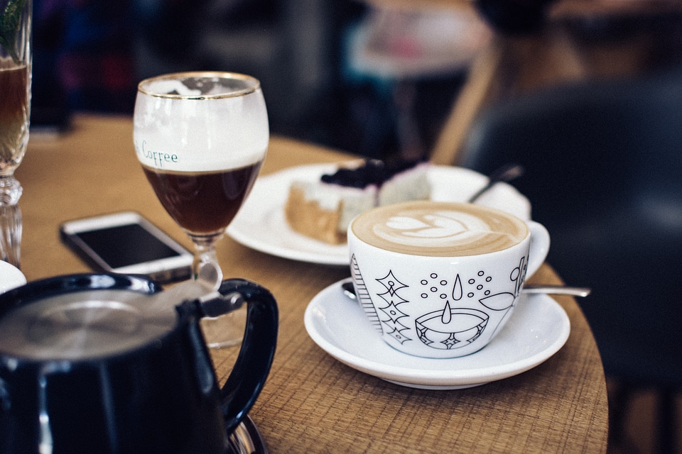 Cappuccino with latté art on a table photo