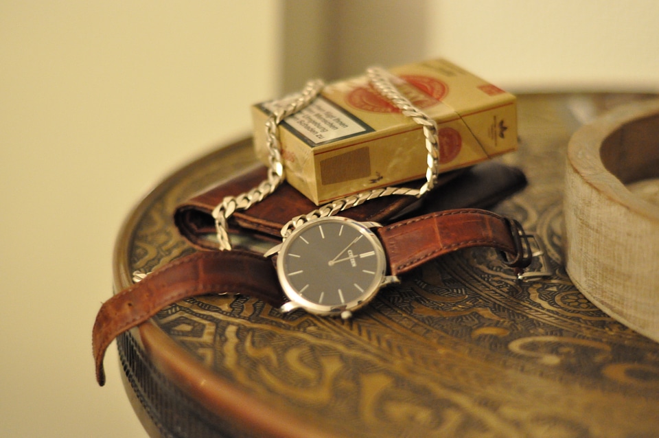 Watch, necklace and cigarettes