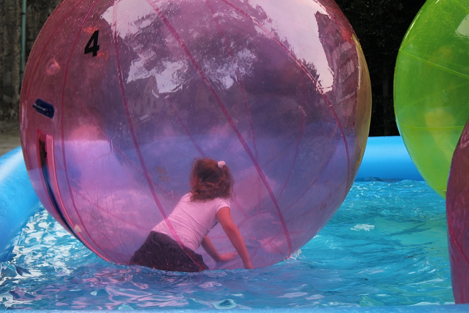 Girl in giant waterball