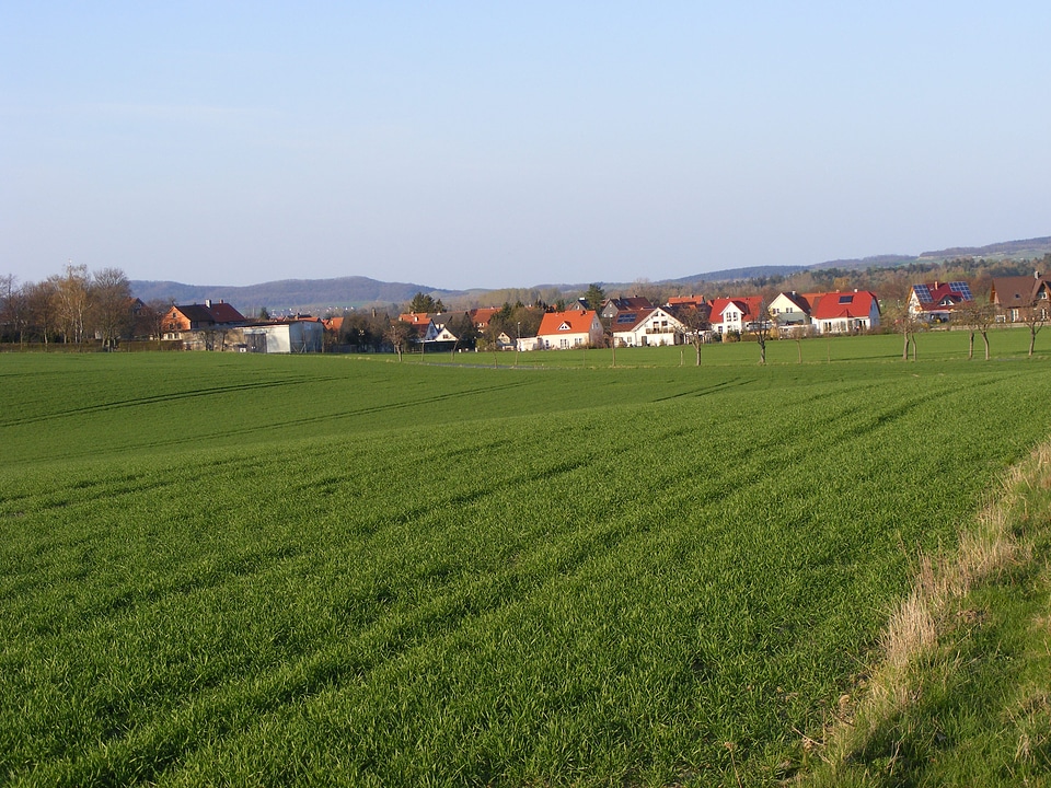 Small German village behind green fields